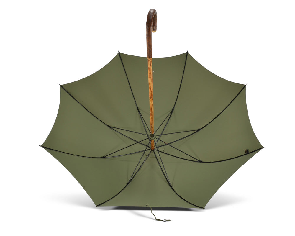 Olive-green umbrella with rust-red dots and handle made of chestnut wood